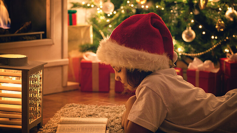 Beautiful Little Girl Reading a Book